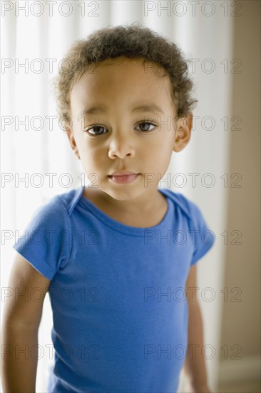 Serious mixed race young boy