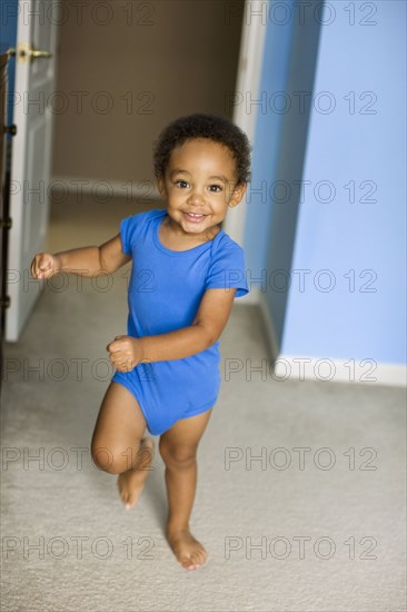 Young mixed race boy running