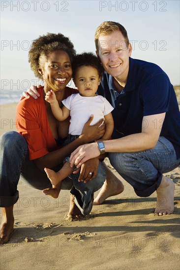 Multi-ethnic family enjoying beach