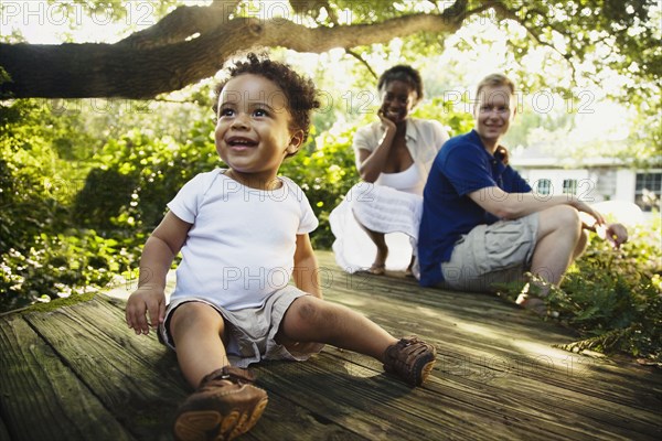 Multi-ethnic family enjoying garden