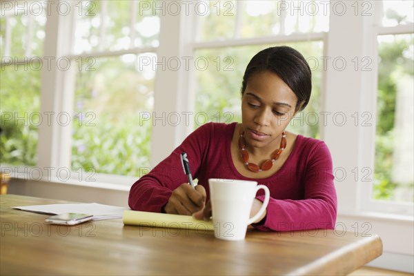 African woman working at table