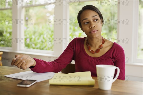 African woman working at table