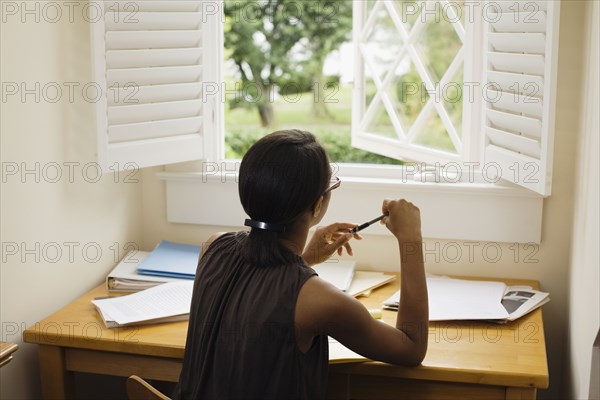 African woman sitting at desk