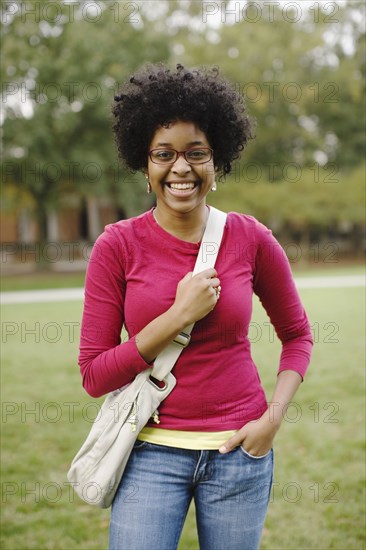 Mixed race woman smiling in park
