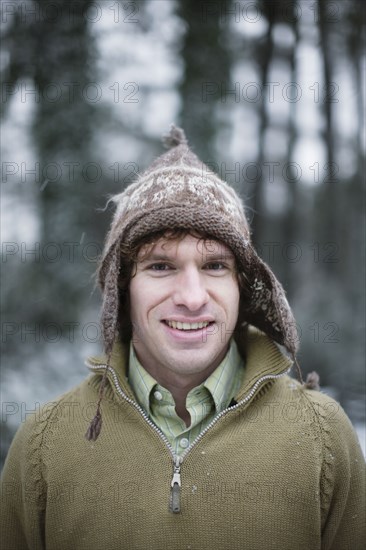 Caucasian man in cap outdoors