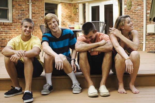 Friends hanging out together on patio