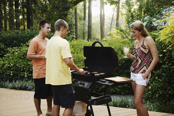 Friends hanging out together barbecuing