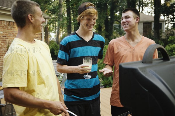 Friends hanging out together barbecuing