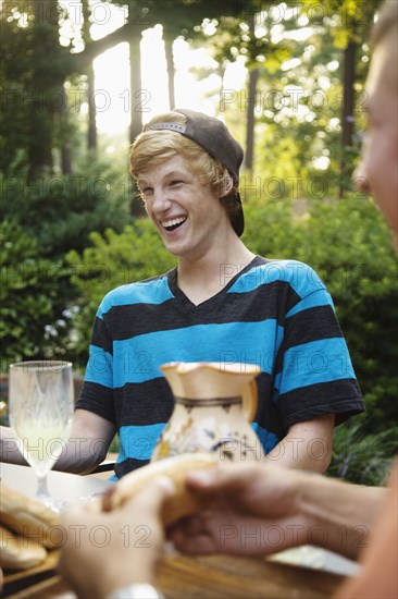 Friends hanging out together eating outdoors