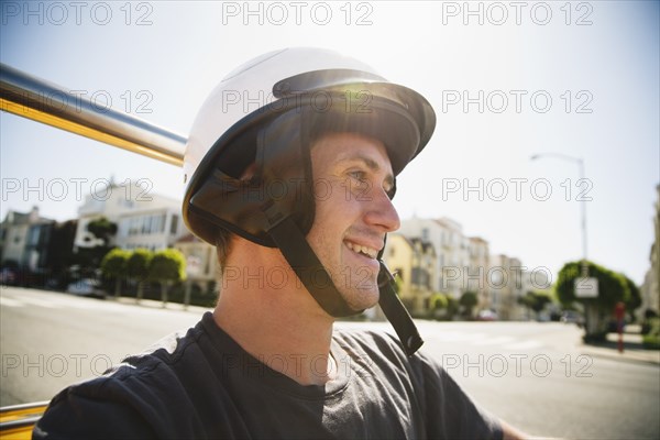 Caucasian man in helmet driving go-cart