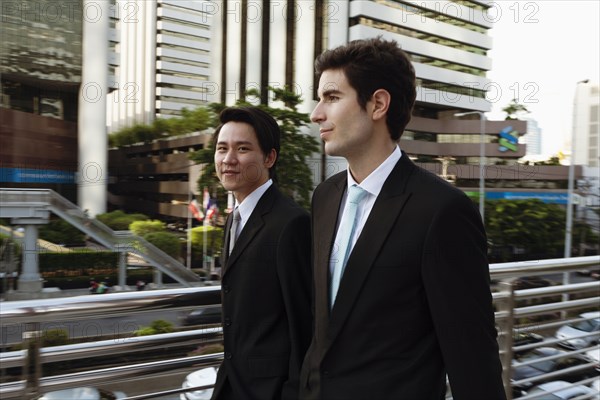 Businessmen walking together outdoors