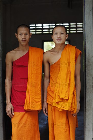 Cambodian monks standing in doorway