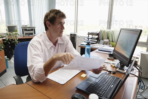 Caucasian businessman working at desk