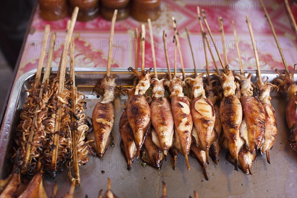 Grilled fish and squid in market