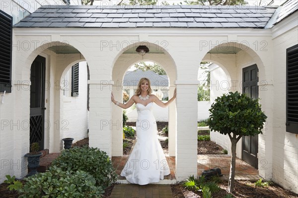 Glamorous Caucasian bride in wedding dress