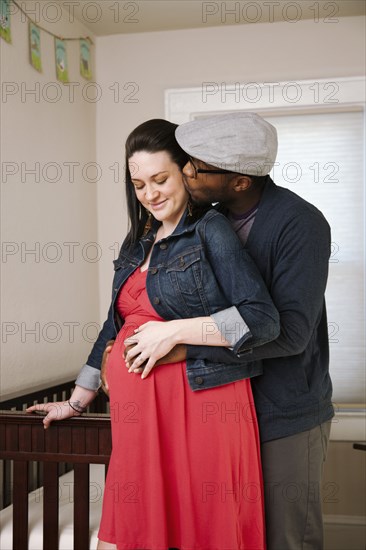 Man hugging pregnant wife