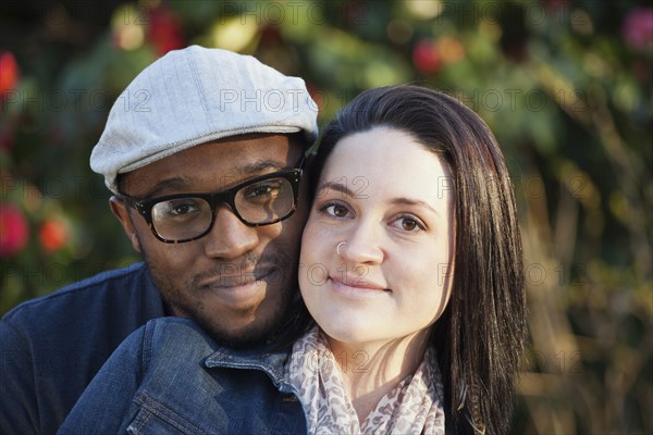 Smiling couple standing outdoors