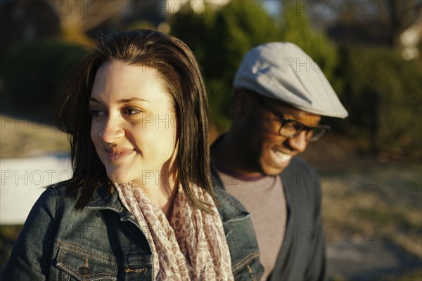 Smiling couple standing outdoors