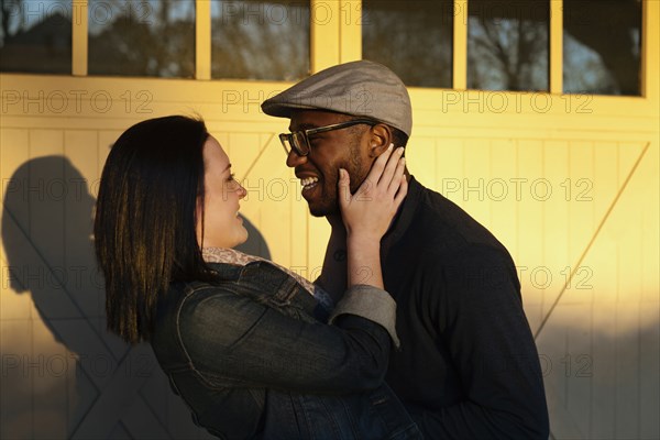 Smiling couple hugging