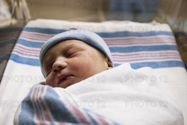 Sleeping Caucasian newborn baby boy