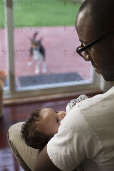 Father feeding baby