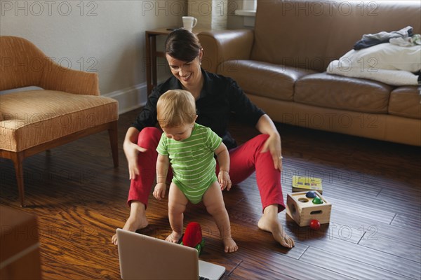 Caucasian mother playing with toddler