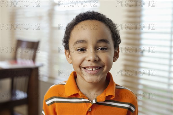 Mixed race boy smiling