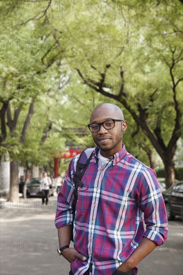 Black man walking on city street