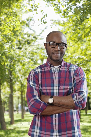 Black man smiling in park