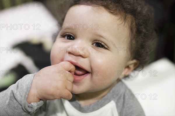 Mixed race baby smiling