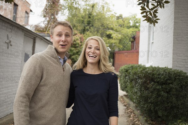 Caucasian couple hugging outdoors