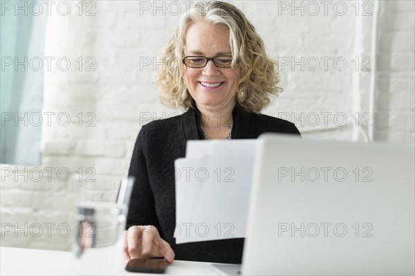 Caucasian architect working at desk