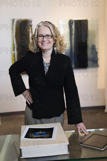 Caucasian woman working in art gallery