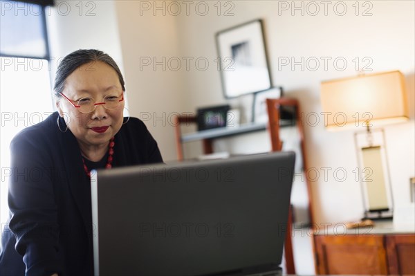Japanese businesswoman working at desk