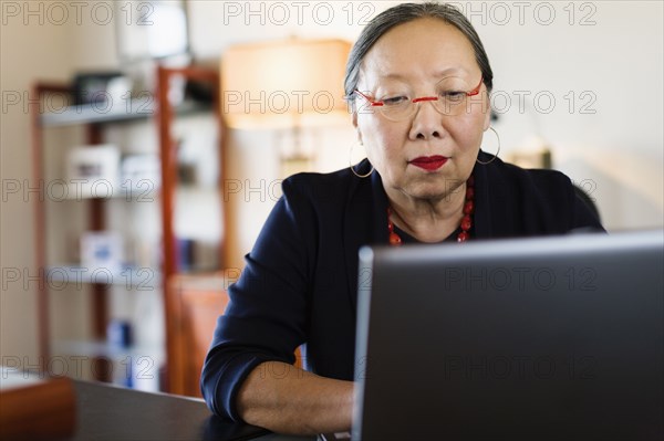 Japanese businesswoman working at desk