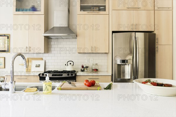 Food and cooking implements on kitchen counter