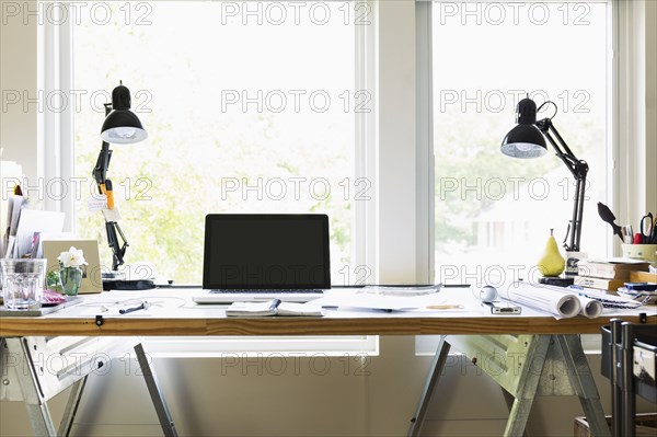 Computer and lamps on desk