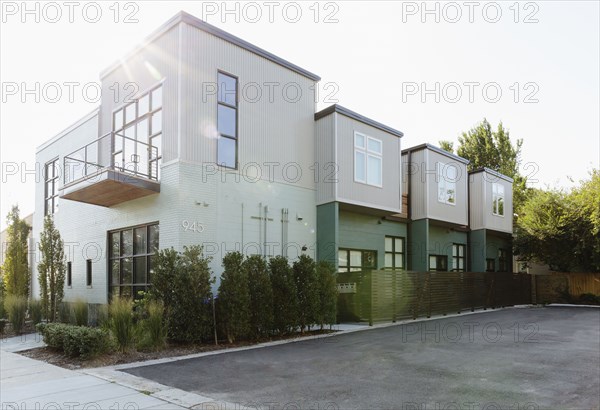 Modern condo building and parking lot