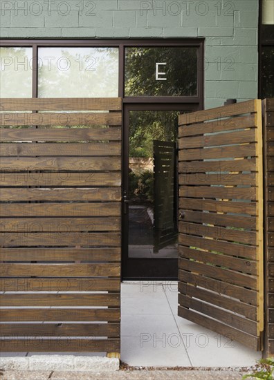 Wooden entrance to modern condo building