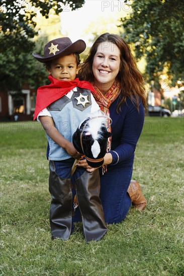 Mother with son dressed as cowboy for Halloween