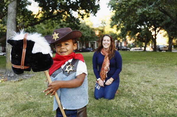 Mother with son dressed as cowboy for Halloween