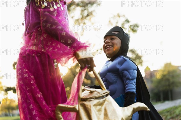 African American children trick-or-treating on Halloween