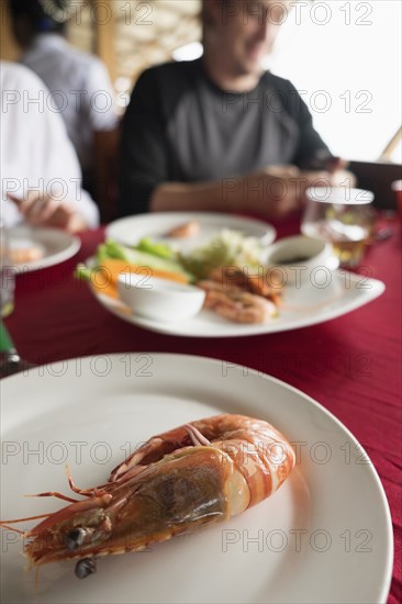 Close up of plate of shrimp on restaurant table