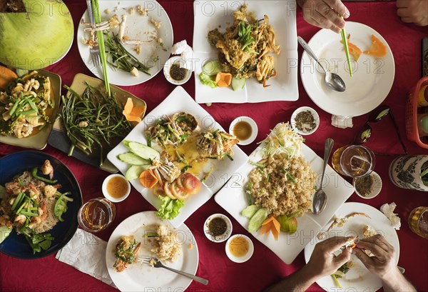 Overhead view of seafood and salad dishes on table