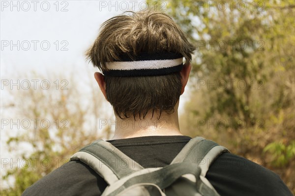 Caucasian man wearing sweat band