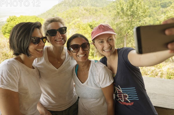 Friends taking selfie outdoors