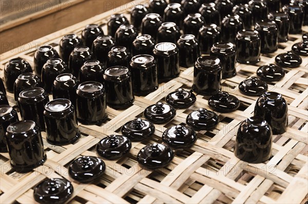 Traditional lacquerware drying on rack