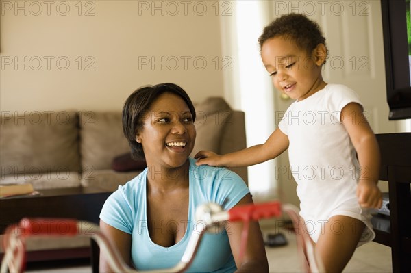 Mother and son playing in living room