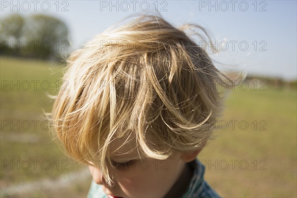 Close up of Caucasian boy in park