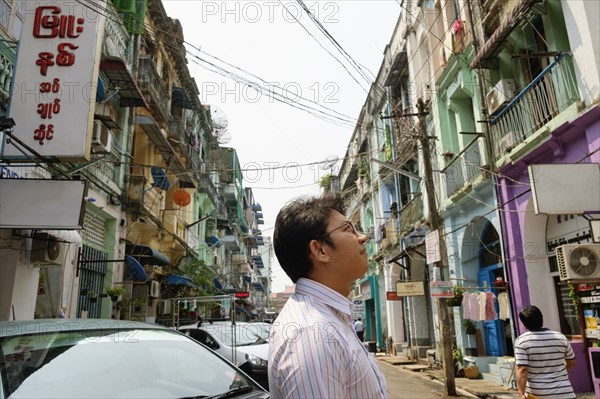 Asian businessman standing in city